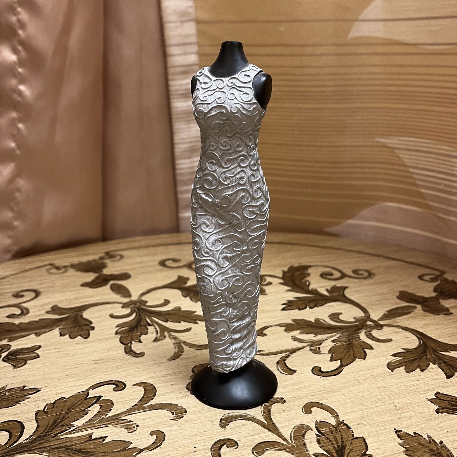silver gown figurine