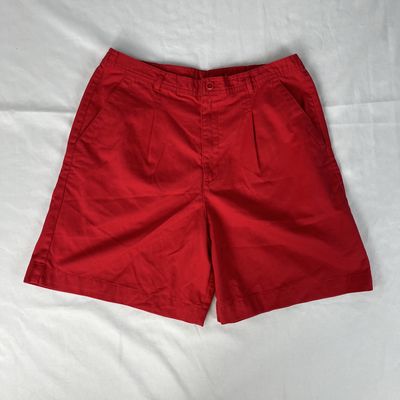 red pleated shorts