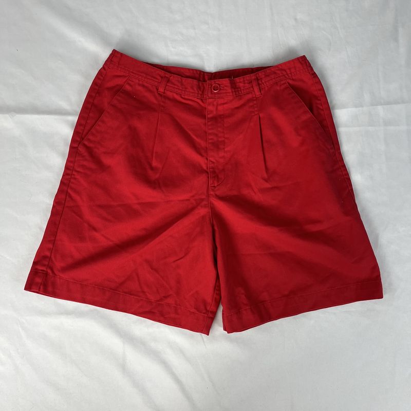 red pleated shorts
