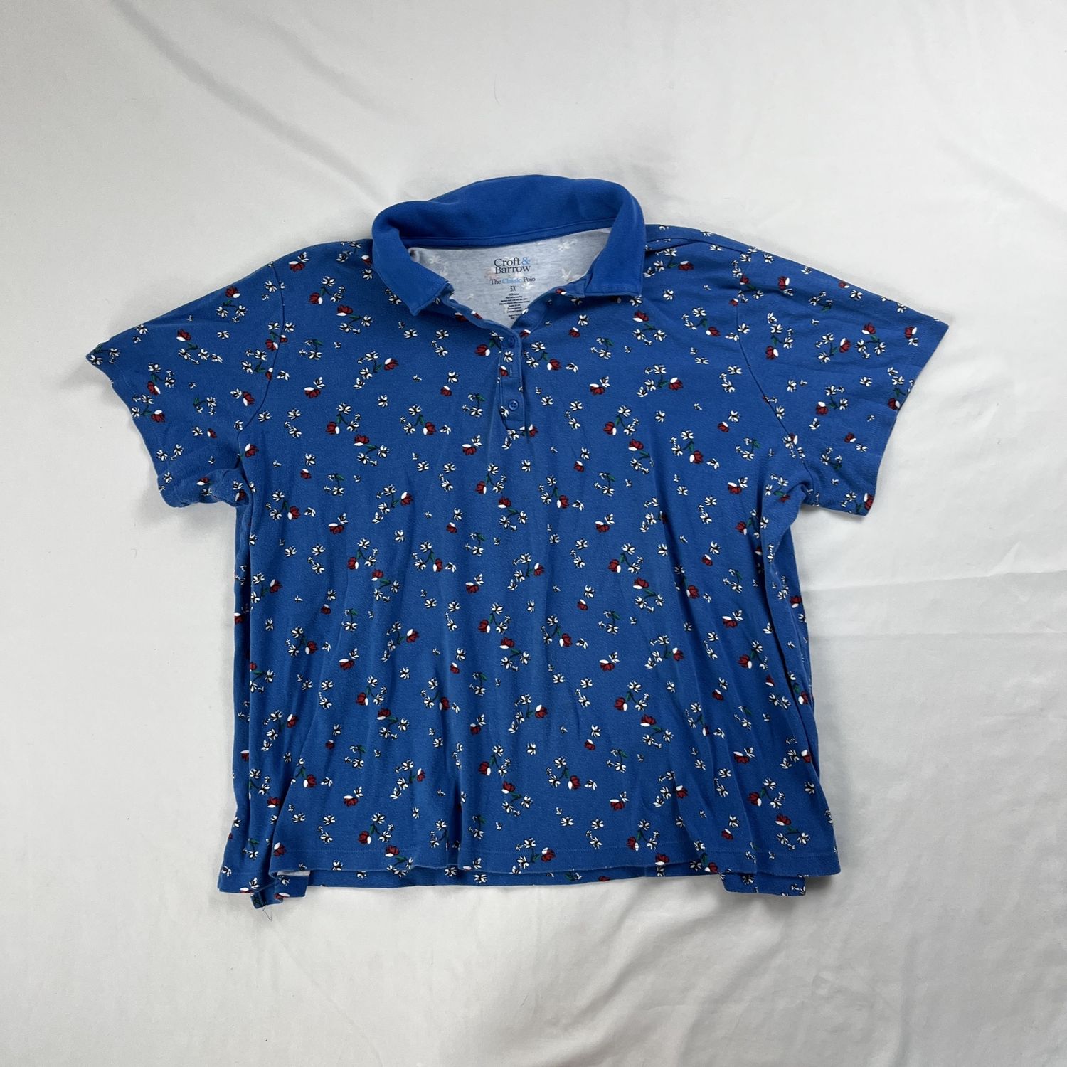 blue polo w/ red flowers