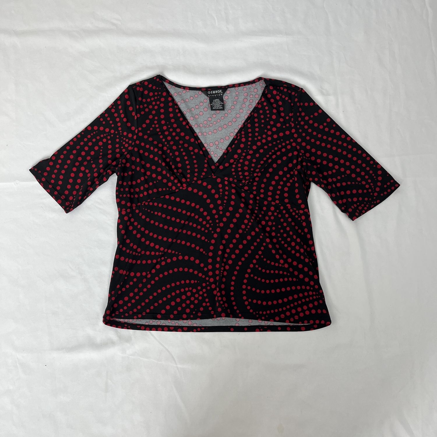 red polka dot top
