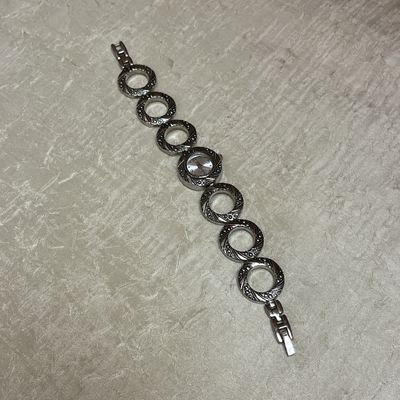 textured silver O watch
