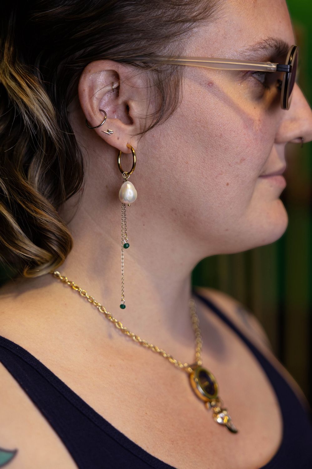 green hoop and pearl earrings