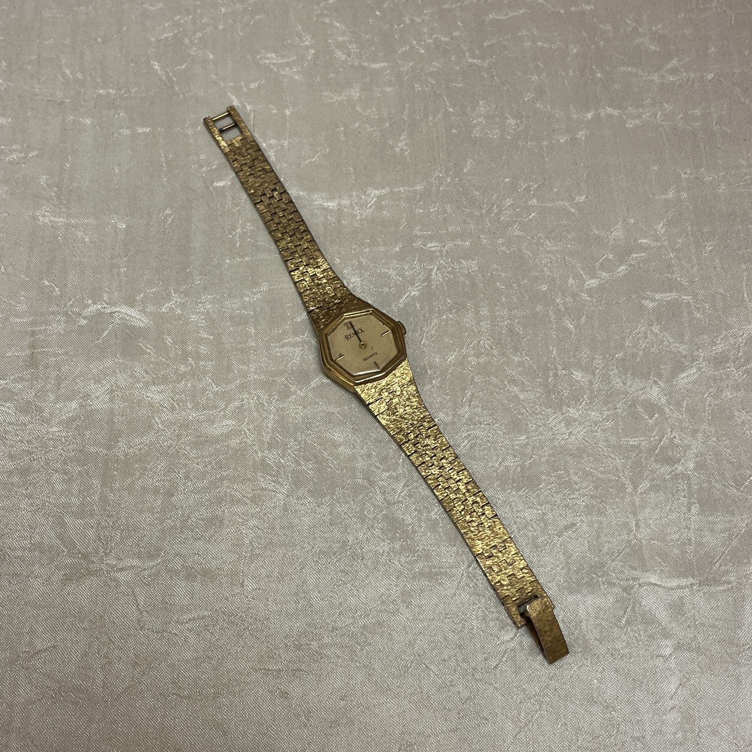 Gold octagon watch