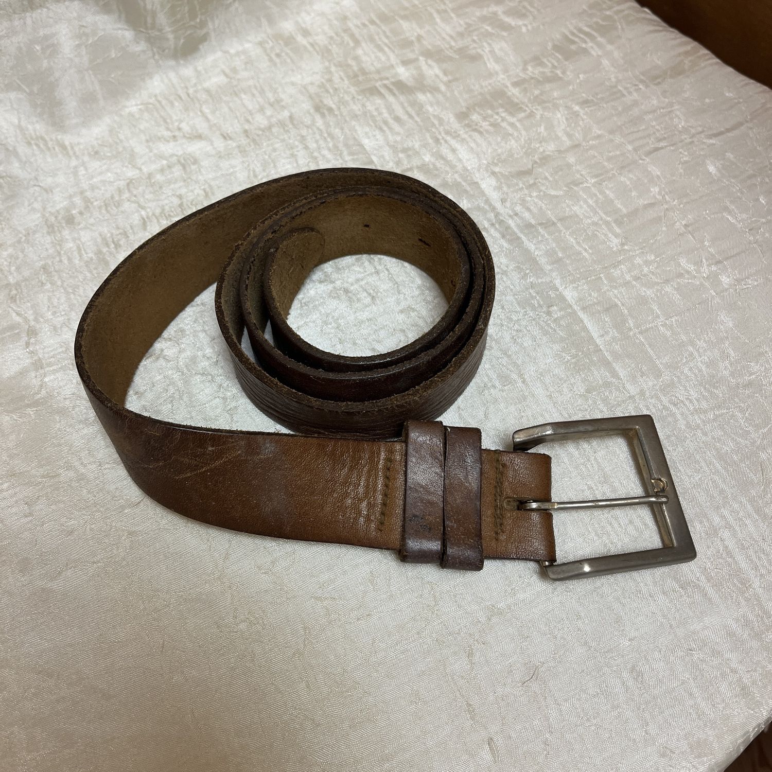 dusty worn brown belt