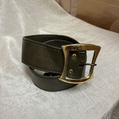 gold buckled green belt