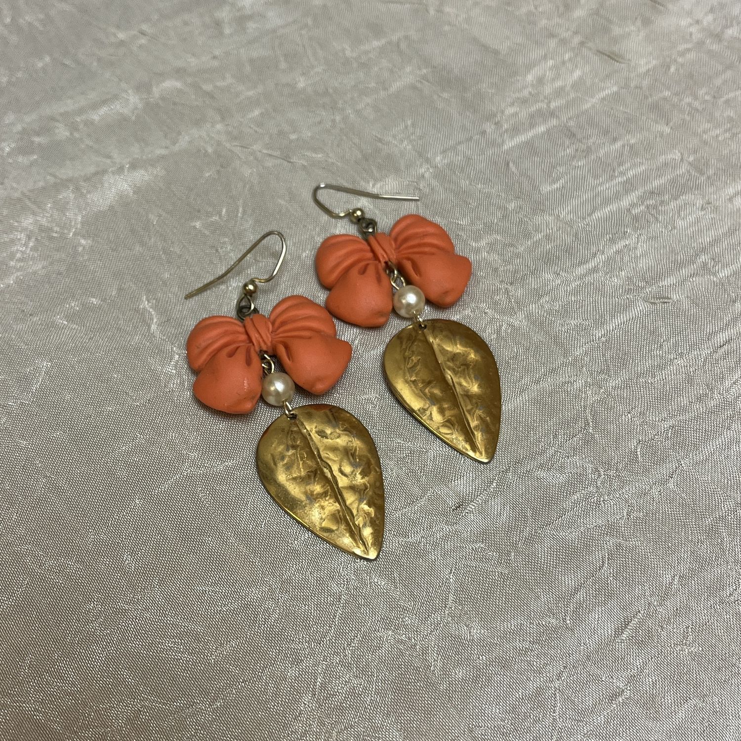 Gold bow leaf earrings