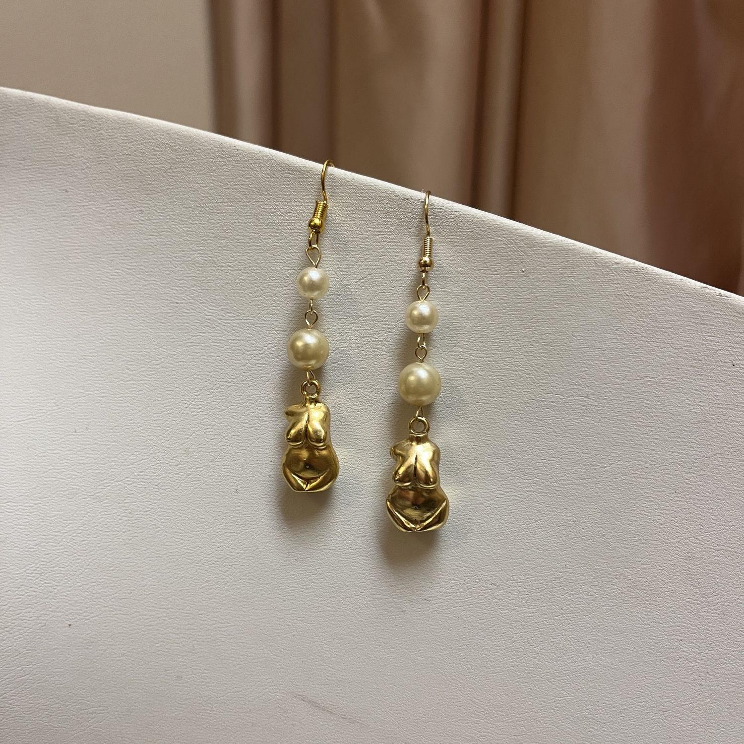 double pearl boob earrings