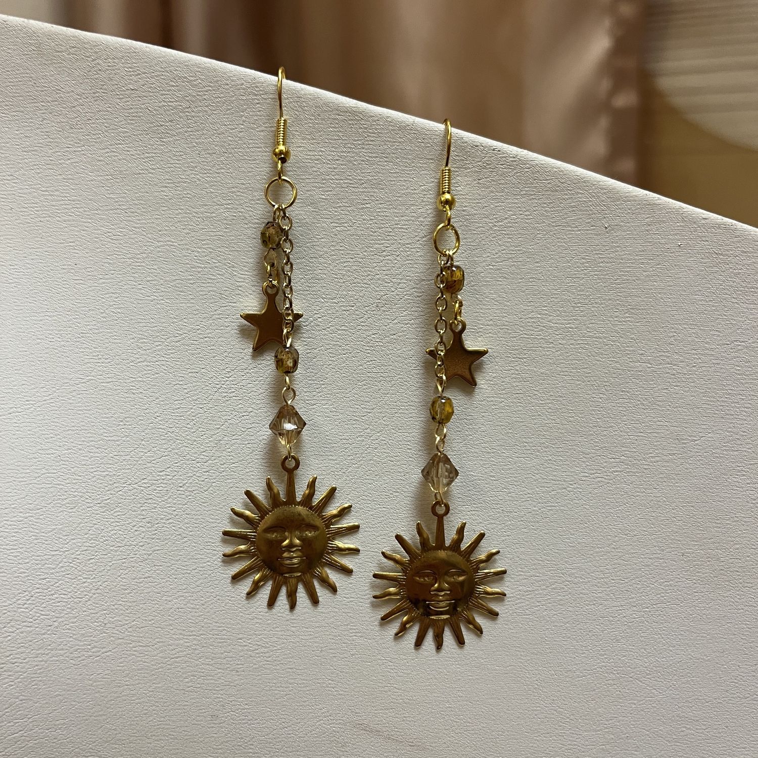 Gold Sun and Star Dangle Earrings
