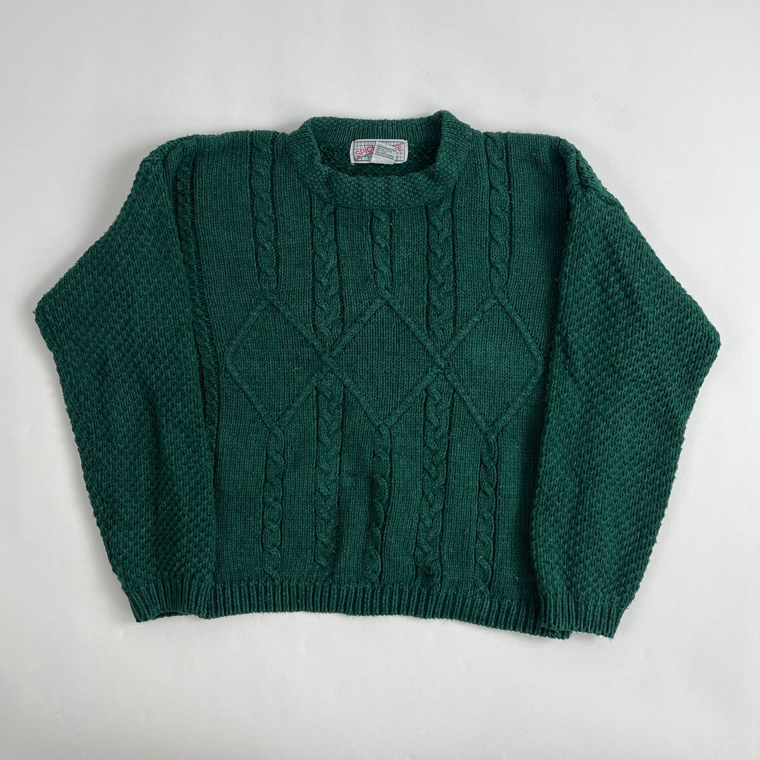 green cableknit sweater