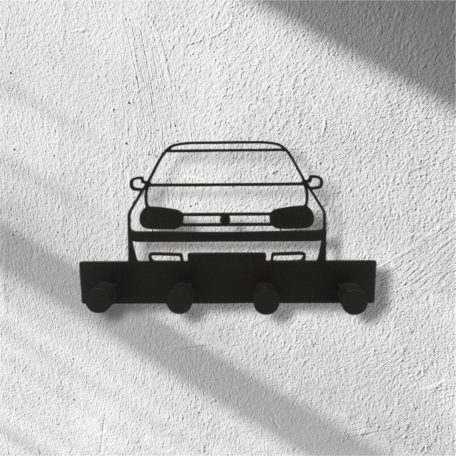 Plastikowy wieszak na klucze z modelem samochodu Volkswagen Golf 4.