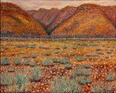 McDonnell ranges escarpment - a rocky textured desert landscape with brilliant glowing orange hills &amp; deep purple coloured shadows!