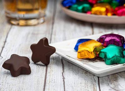 Madelaine Chocolates Solid Premium Dark Chocolate Stars, Wrapped In Italian Foil In Assorted Colors. - 1/2 Pound