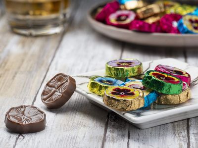 Madelaine Solid Premium Milk Chocolate Pansy Flowers Wrapped In Assorted Colors Of Italian Foil (1/2 LB)