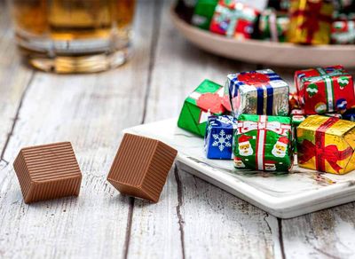 Madelaine Solid Premium Milk Chocolate Presents, Wrapped In Italian Foils, Featuring Assorted Designs (Half Pound)