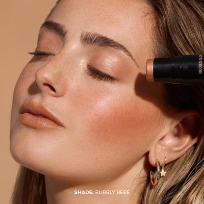 Nudestix Nudies Glow Highlighter Stick wBlending Brush, Dewy Cream Makeup for Cheeks, Eyes, Lips, Soft Metallic Glowy Face Color and Contour, 0.28 oz (8g) (Bubbly Bebe)