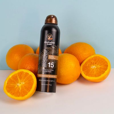 Australian Gold Continuous Spray Sunscreen with Instant Bronzer SPF 15, Immediate Glow & Dries Fast, Broad Spectrum, Water Resistant, Non-Greasy, Vegan and PETA Approved, Cocoa Dreams Scent, 6 Ounce