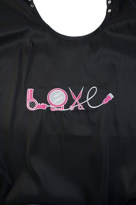 Betty Dain Embroidered Love Cutting/Styling Cape, Stylish, Lightweight Iridescent Fabric with Embroidered Decal, Versatile Color and Water-Resistant, Snap Neck Closure, Black/Multi, 45 x 60