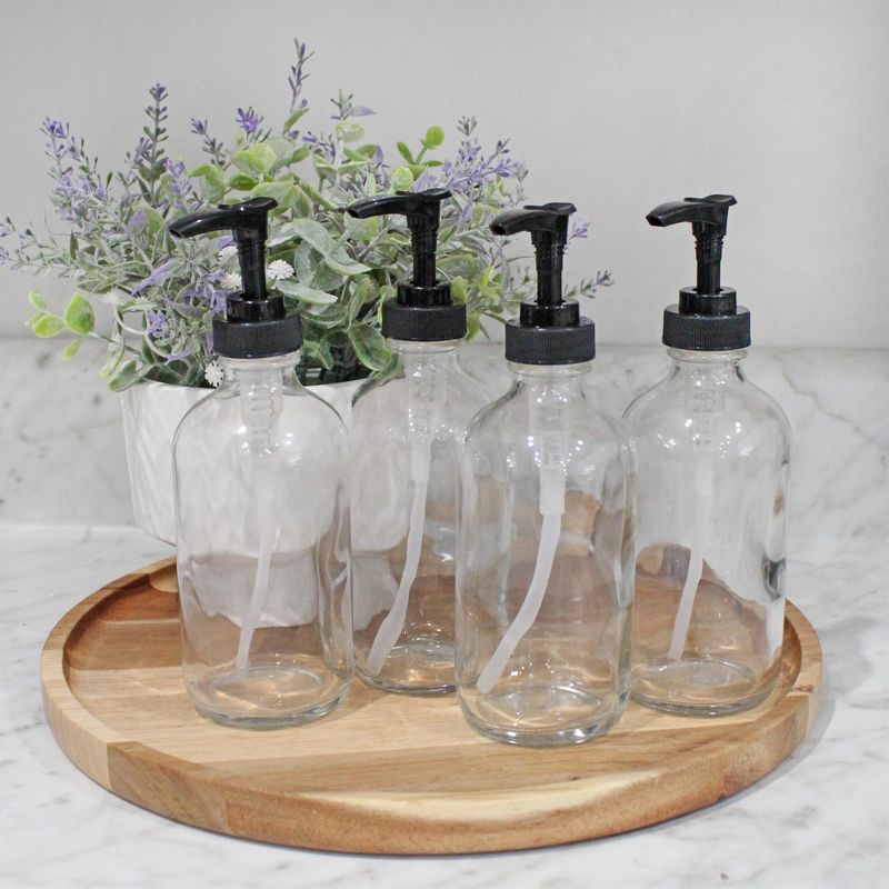 Cornucopia Brands 8oz Clear Glass Pump Bottles (4-Pack w/Black Plastic Pumps), Great as Essential Oil Bottles, Lotion Bottles, Soap Dispensers, and More
