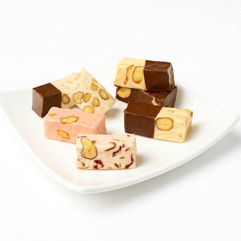 Andy Anand Roasted Almond Soft Nougat Brittle, offering 14 bite-sized wrapped pieces with 5 delightful flavors, imported from Europe for a delectable taste experience, and it's gluten-free (7 Oz)
