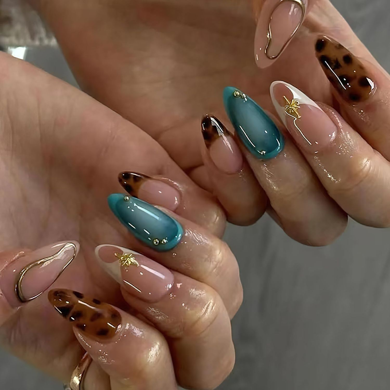 Jremg Press on Nails Medium Almond Fake Nails with Designs Brown Leopard French Tip Glue on Nails 3D Gold Star Charms Full Cover False Nails Blue White Gradient Stick on Nails for Women Girls 24Pcs