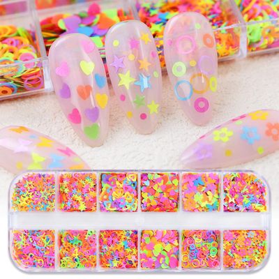 12 Grids Colorful Heart Nail Art Glitter Sequins 3D Holographic Mixed Pack Butterfly Star Letter Designs Glitter Flakes Acrylic Nail Supplies for Women Manicure Decorations Accessories Set