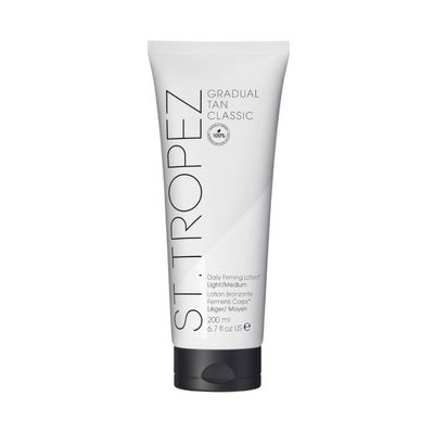St.Tropez Gradual Tan Firming Lotion, Light/ Medium Shade, Sun Kissed Glow Self Tan Moisturizer, 5 Skincare Benefits, Vegan, Natural &amp; Cruelty Free, 6.7 Fl Oz