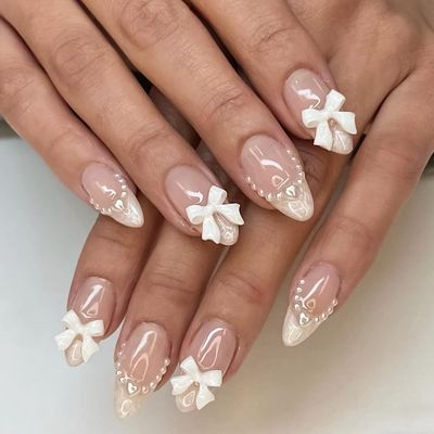 Almond Press on Nails French RIICFDD Short Fake Nails Nude Pink False Nails Cute Bow Nail Charms Design Acrylic Nails French Pearls Press on Nail Full Cover Glue on Nails for Women Girls 24 Pcs