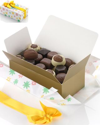 Ballotin of Belgian luxury pralines 250 g, packaged as a gift with yellow ribbon. No preservatives. Premium Belgian chocolate.