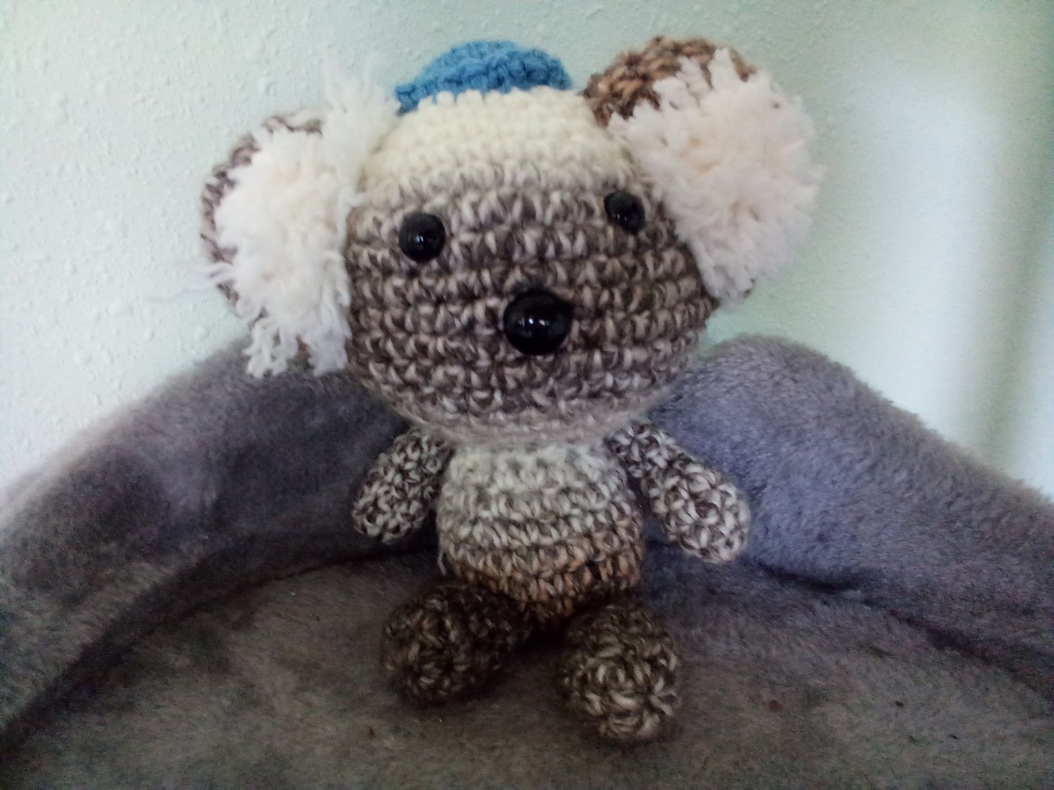Little koala bear with blue hat