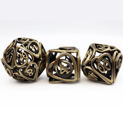 fb DICE SET 7 METAL HOLLOW HEARTS ANTIQUE BRONZE