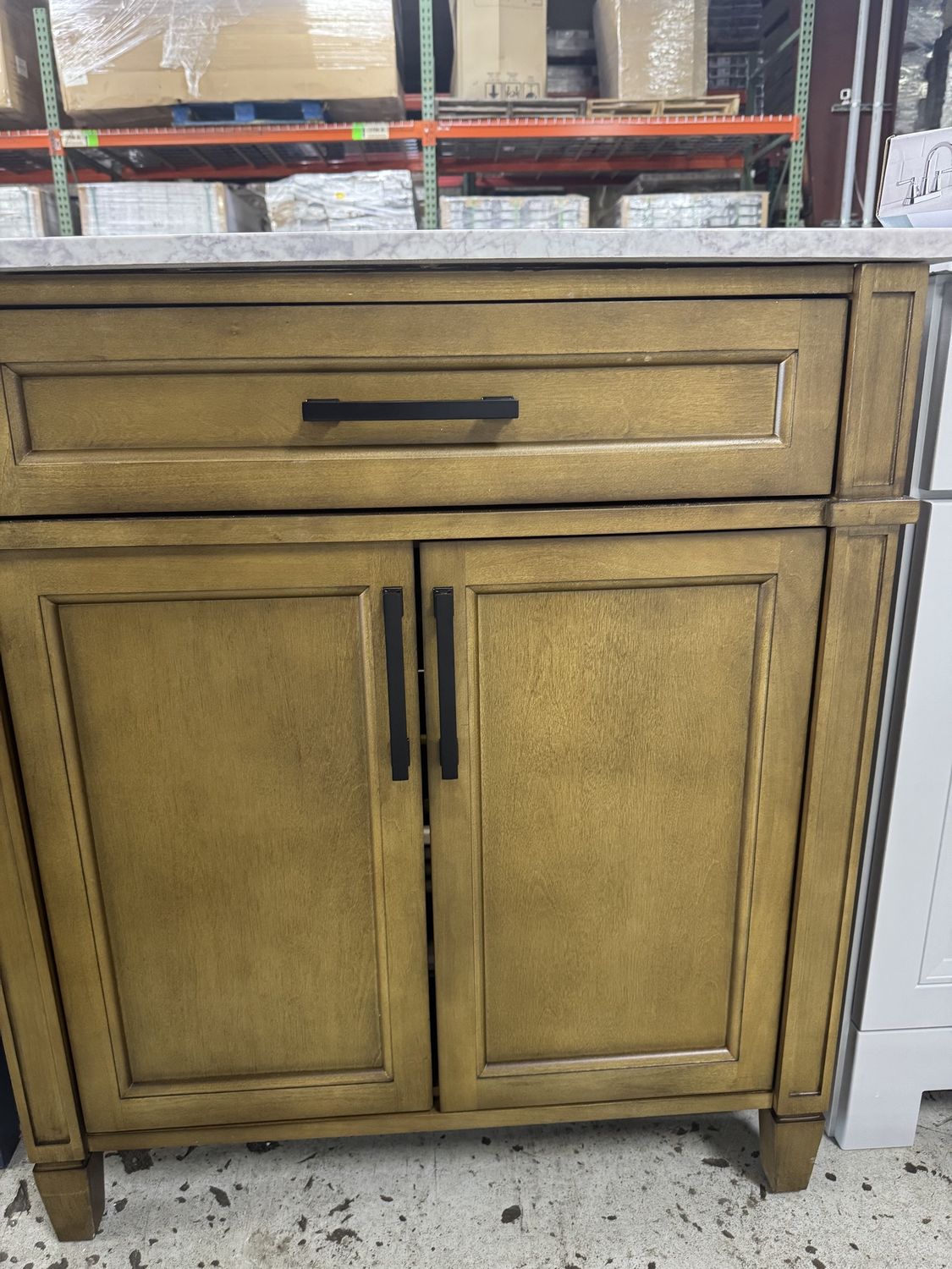 31in. X 22in. Beige bathroom vanity with top and sink.