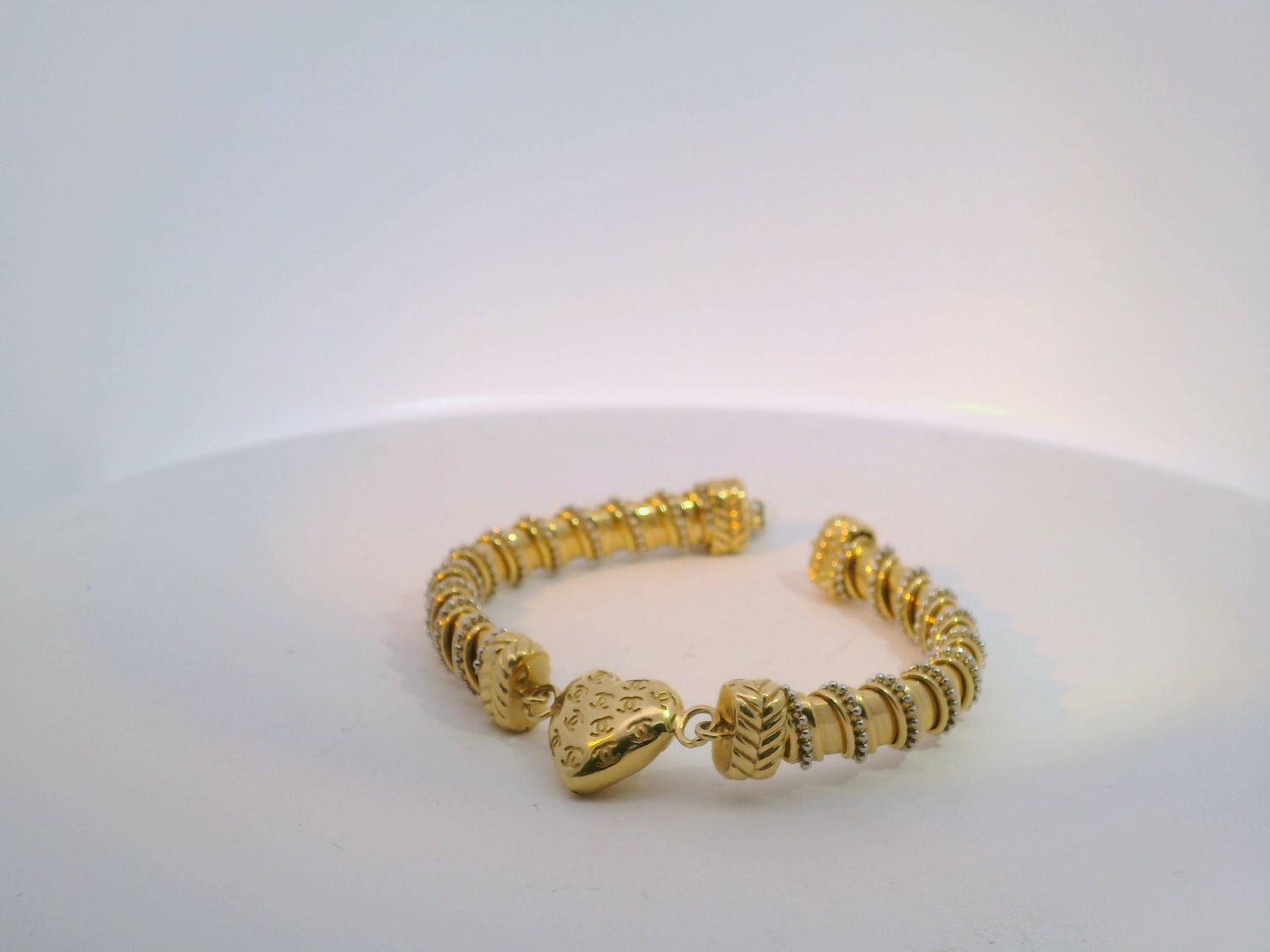 Gleaming Gold Bangle with Heart Charm