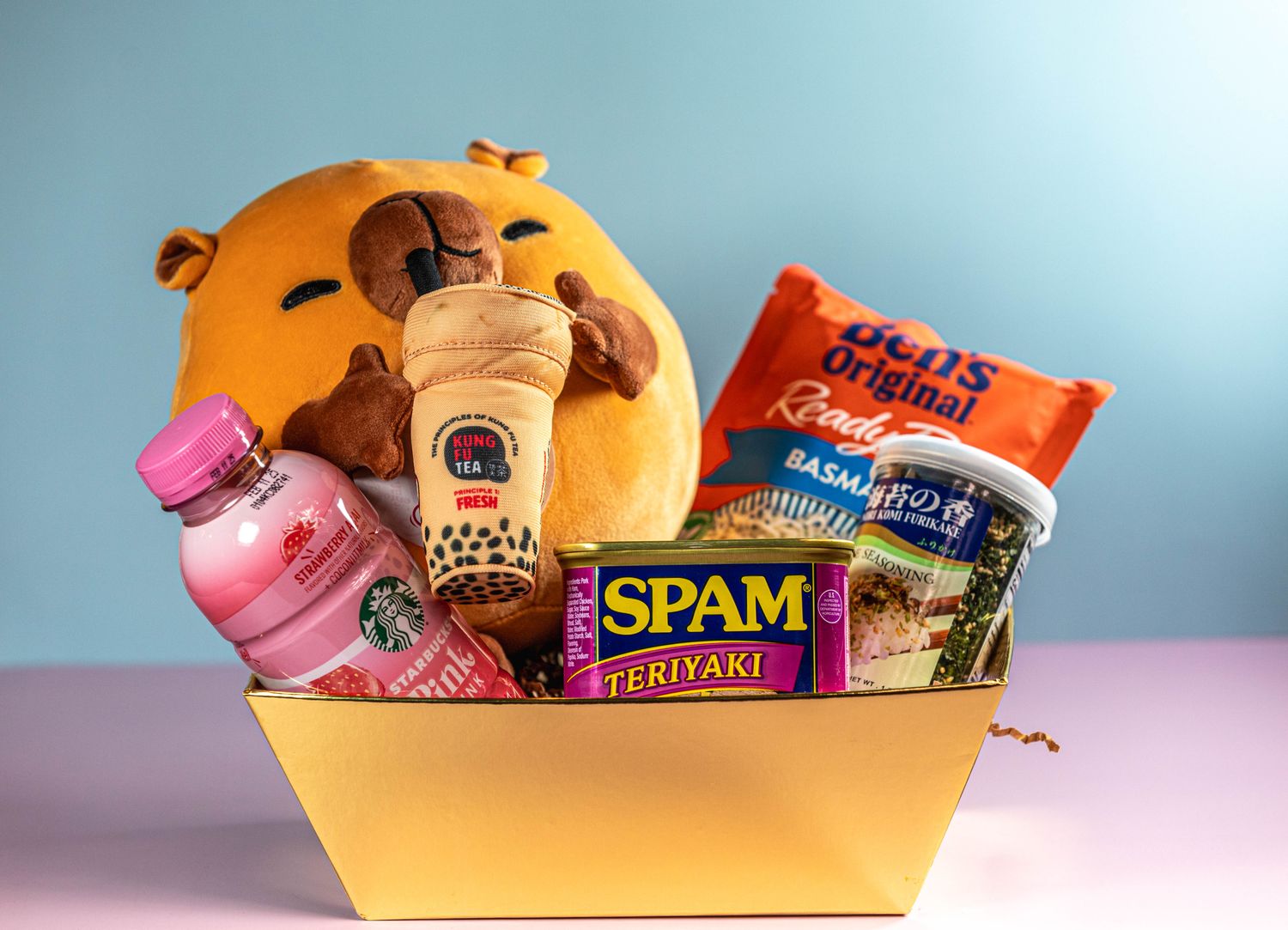 Gold Box , Boba Capybara, Pink Drink, Spam, Seaweed, Rice, Furikake