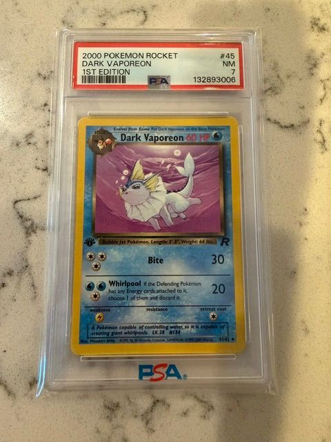 Pokemon Rocket Dark Vaporeon 1st ed. PSA 7