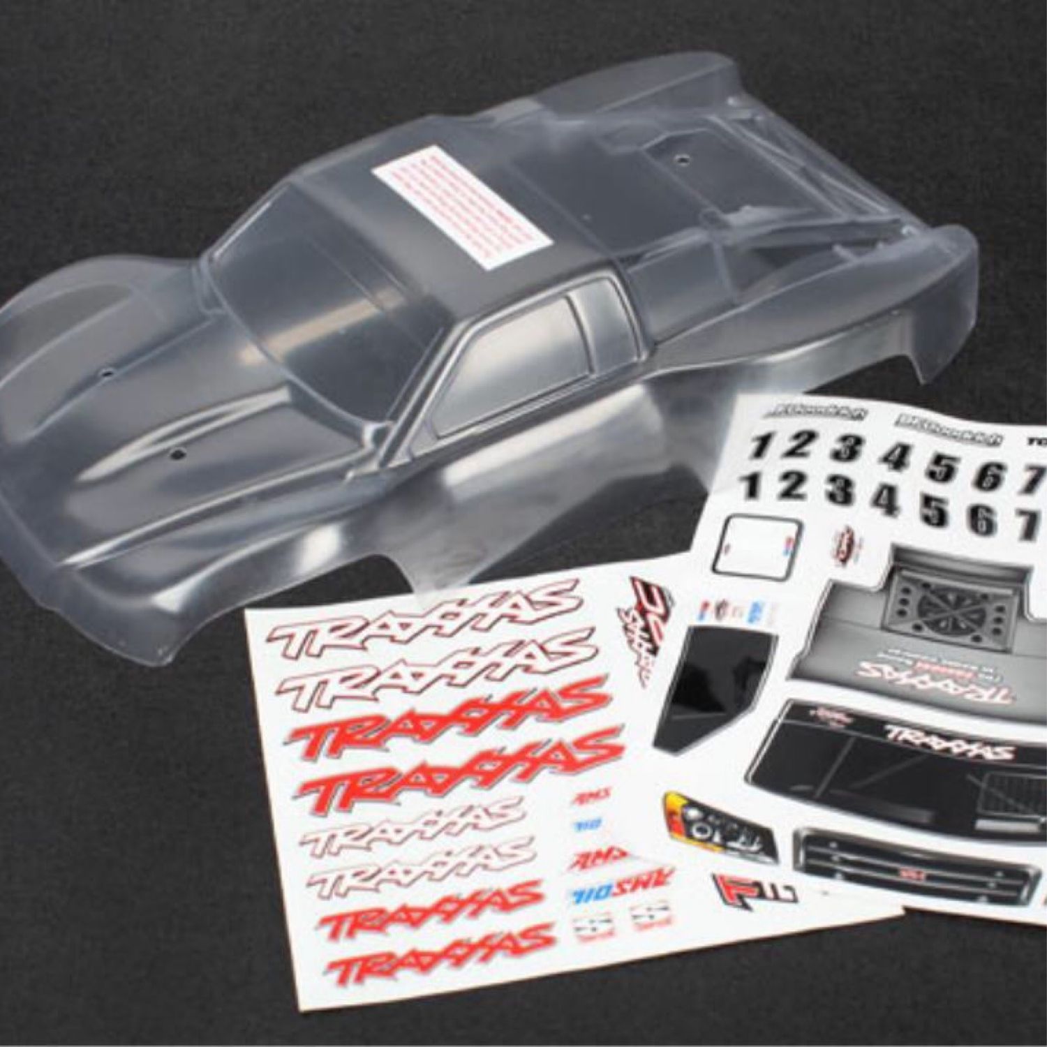 Traxxas Body, 1/16th Slash (clear, requires painting)/ grille, lights decal sheet #7012R
