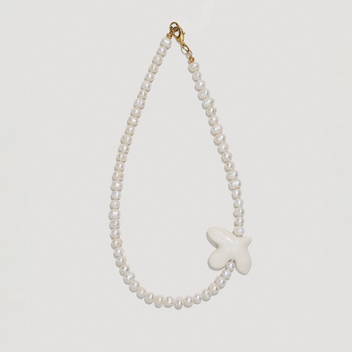 MYRNI necklace with medium pearls and bird on a soft base