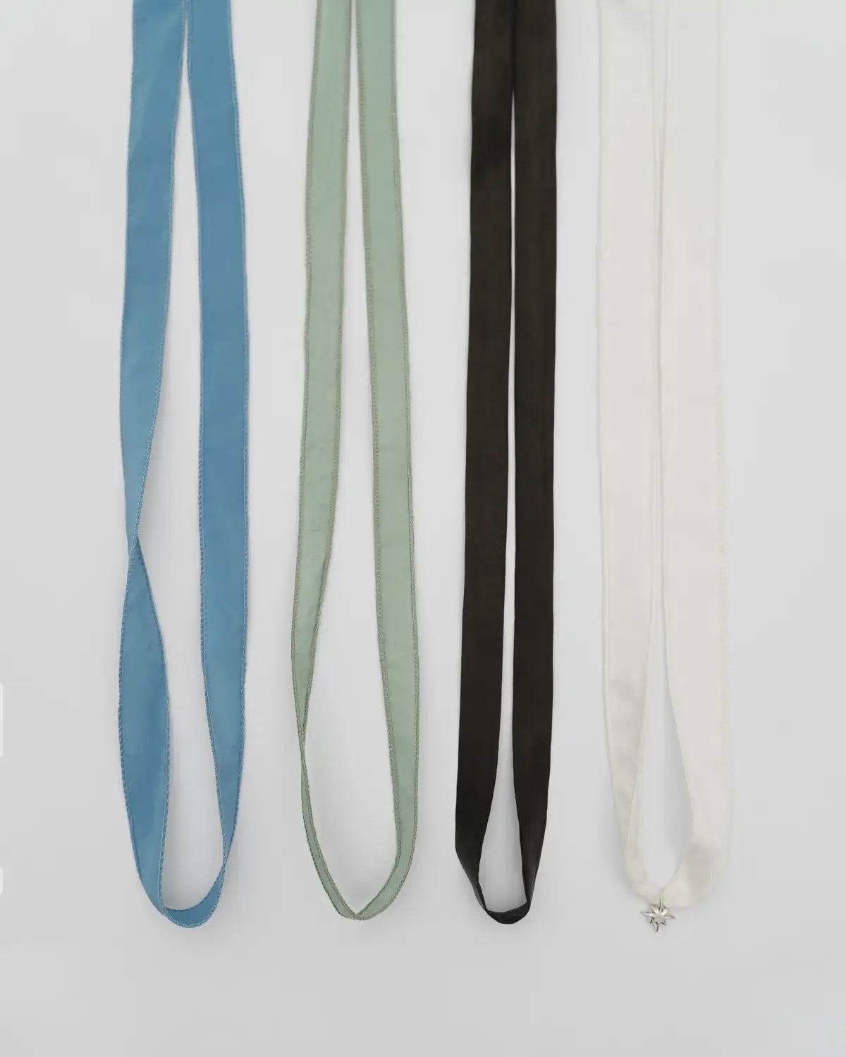 DRIMOTA pendant with silver star, Packaging: Set of wide silk ribbons