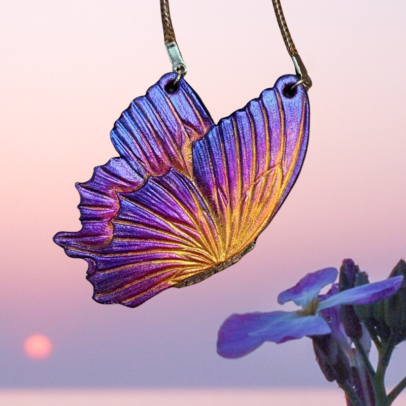 Tooled leather fantasy sunset butterfly pendant