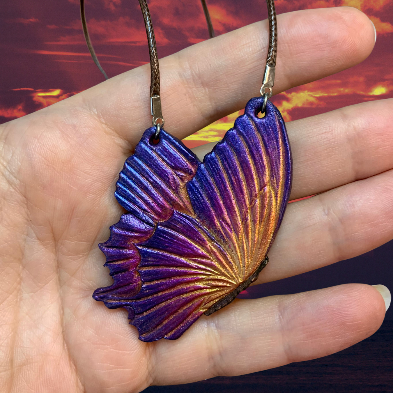 Tooled leather fantasy sunset butterfly pendant
