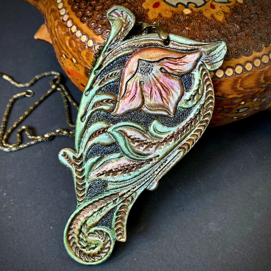 Tooled leather floral pendant in Western style