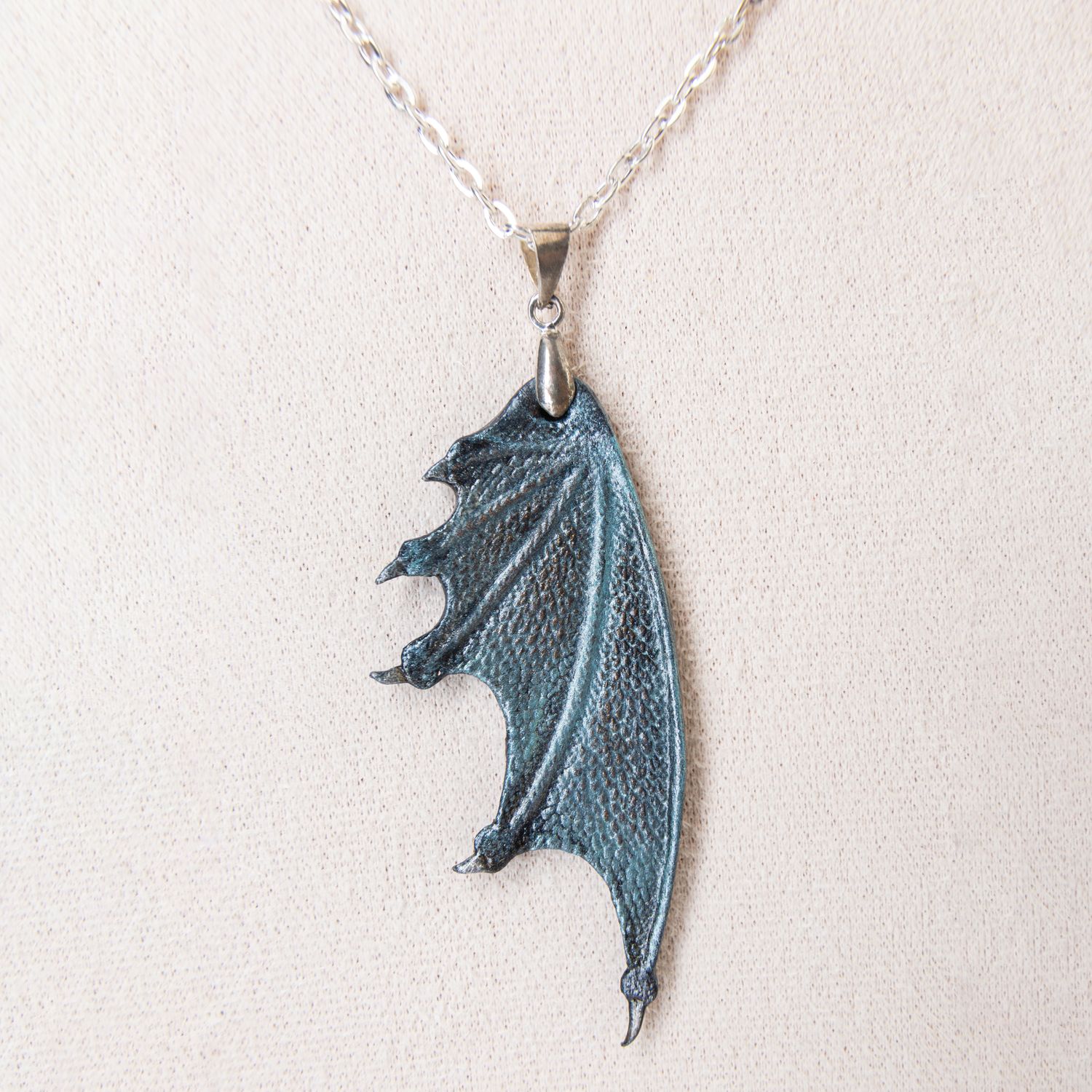 Tooled and leather dragon wing pendant with sterling silver chain