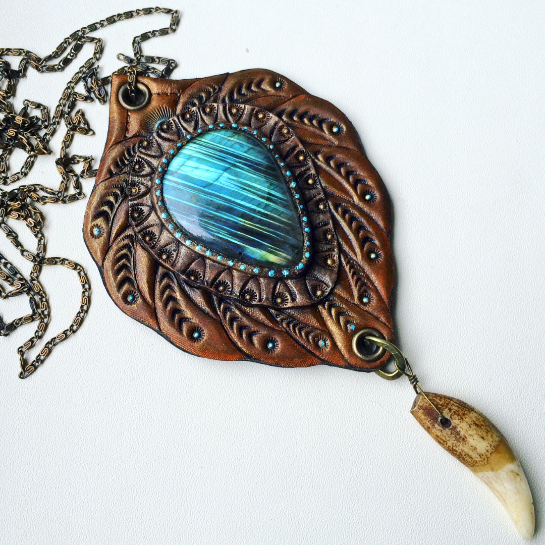 Tooled leather tribal pendant with blue labradorite and wolf fang