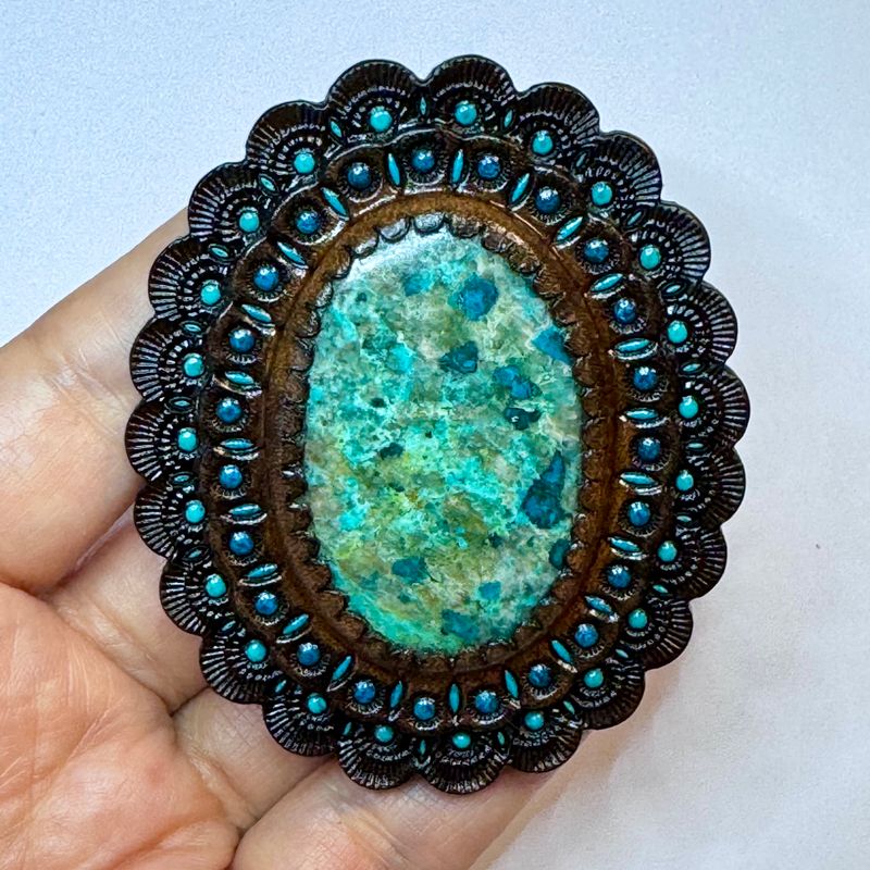 Hand tooled leather concho with chrysocolla