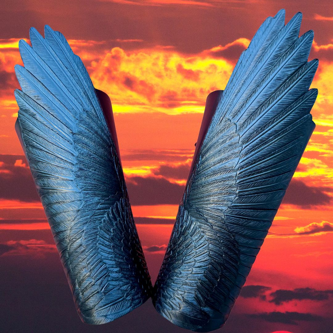 Tooled leather raven wings shaped armguards