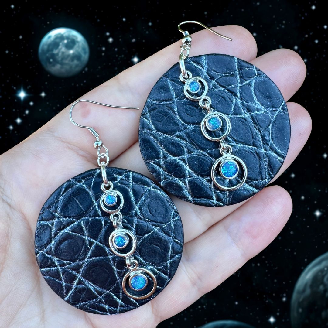 Crocodile leather earrings adorned with silver pendants