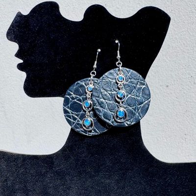Crocodile leather earrings adorned with silver pendants