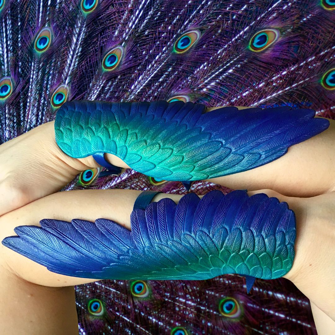 Pair of tooled leather Peacock wing bracers with iridescent rainbow sheen