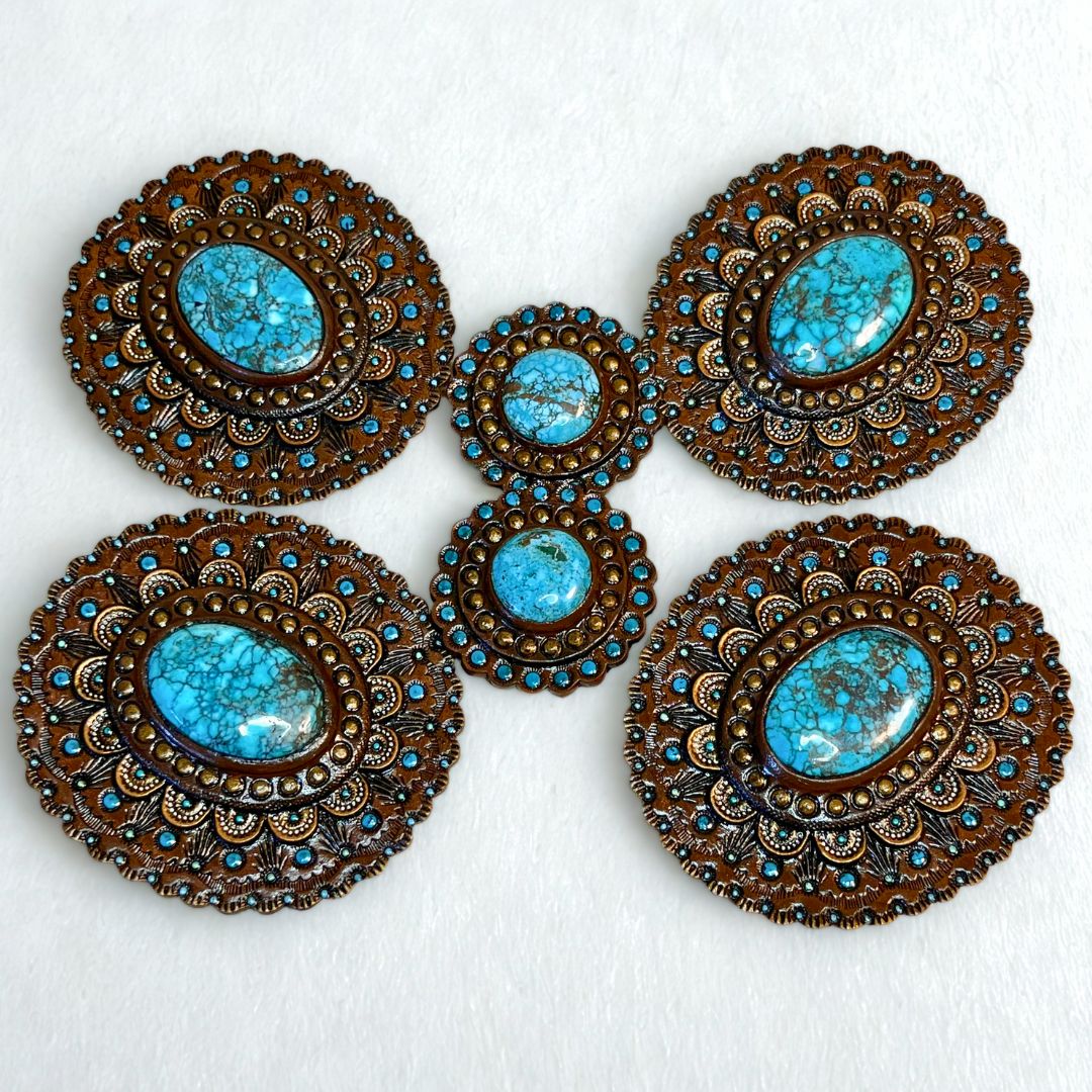 Set of matching tooled leather horse tack conchos with turquoise