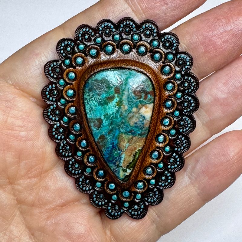 Hand tooled leather concho with chrysocolla